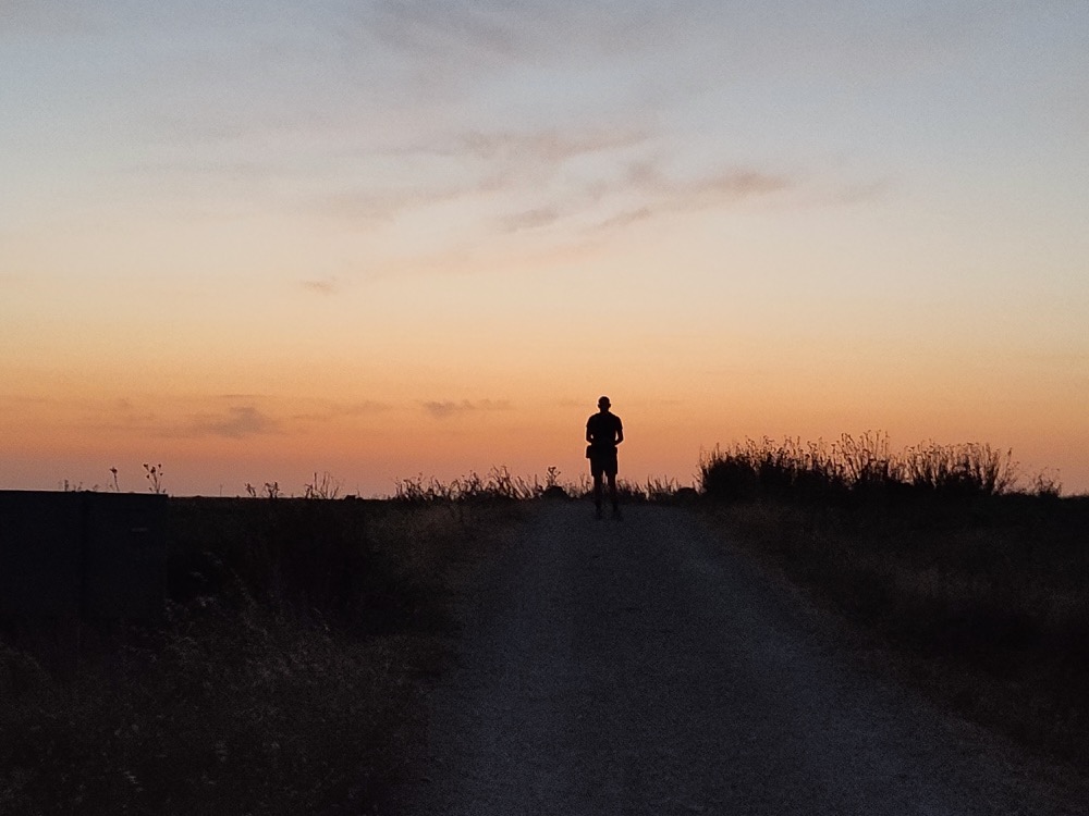 A lone walker on the Camino at dawn